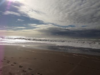 Scenic view of beach against sky