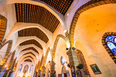 Low angle view of illuminated ceiling of building