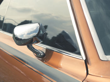 Reflection of car on side-view mirror