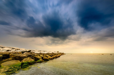 Scenic view of sea against sky during sunset