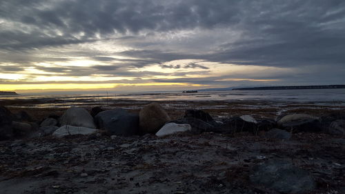 Scenic view of sea against cloudy sky