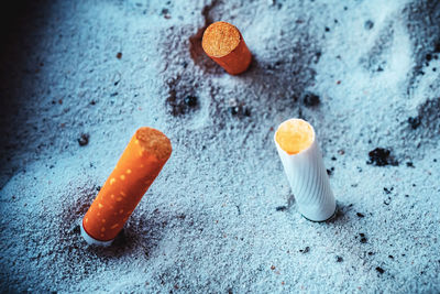 Smoking is harmful to health., no smoking day, cigarette ends in sand ashtray