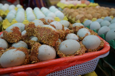 Close-up of eggs in containers for sale at store