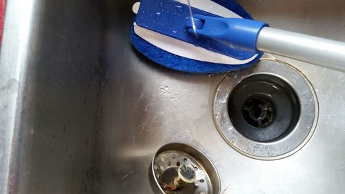 Directly above shot of cleaning brush in kitchen sink