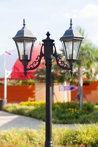 Close-up of street light against sky