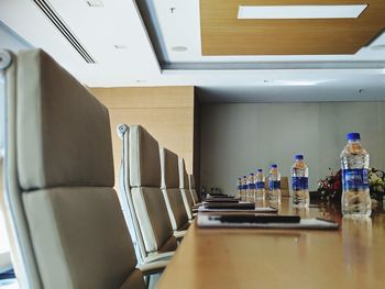 Empty chairs and tables in kitchen