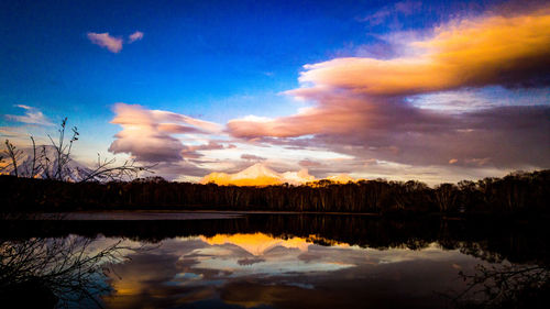 Scenic view of lake against sky during sunset