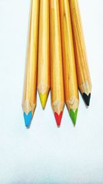 Close-up of multi colored candies against white background