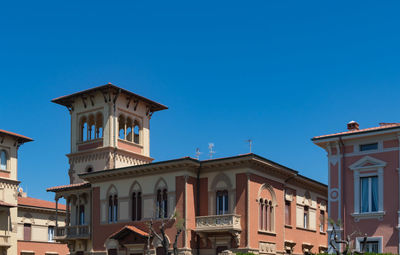 Low angle view of building against blue sky