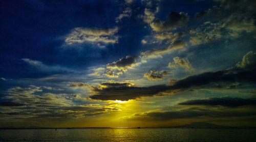 Scenic view of sea against dramatic sky