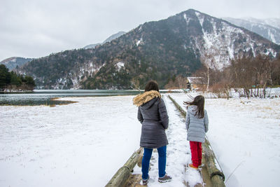 Scenic view of snow covered mountains