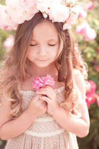 Portrait of smiling young woman with flowers