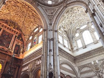 Low angle view of ornate ceiling of building