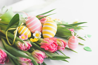 Happy easter. stylish dyed easter eggs with spring flowers