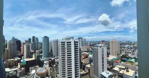 High angle view of buildings against sky in city