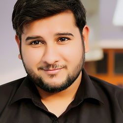 Close-up portrait of smiling young man