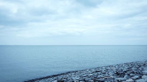 Scenic view of sea against sky during winter