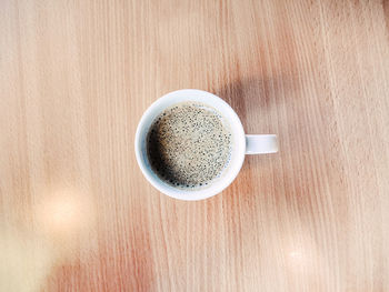 High angle view of coffee cup on table