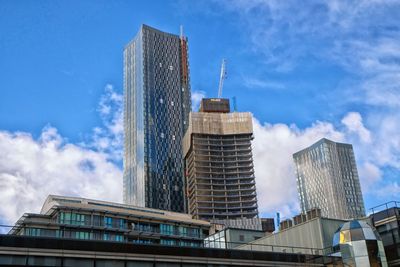 Low angle view of modern buildings against sky