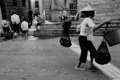 Woman standing on city street