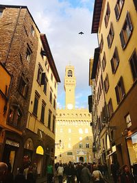 Low angle view of clock tower in city