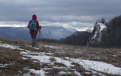 Rear view of man on mountain during winter