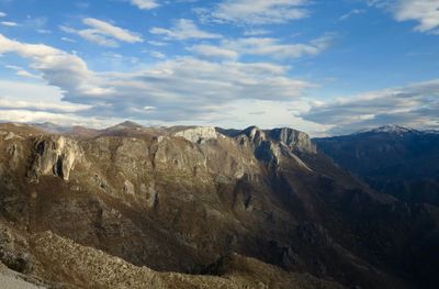 View of mountain range against cloudy sky