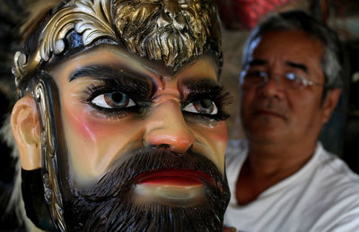 Close-up portrait of man wearing mask