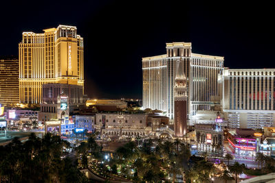 Illuminated buildings in city at night