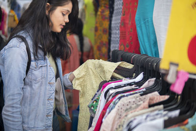 Full length of woman looking at store