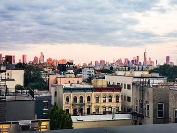 High angle view of buildings in city against sky