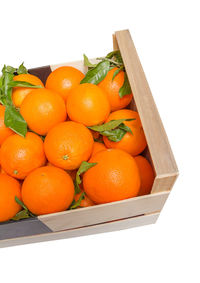 High angle view of orange fruits in box