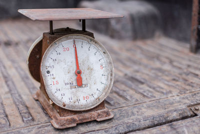 Close-up of clock on table