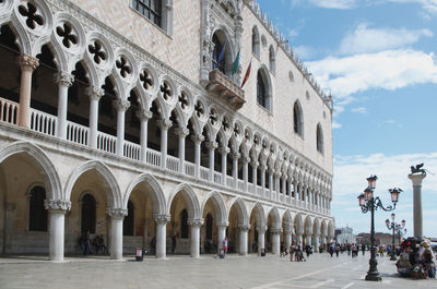 Group of people in front of historical building