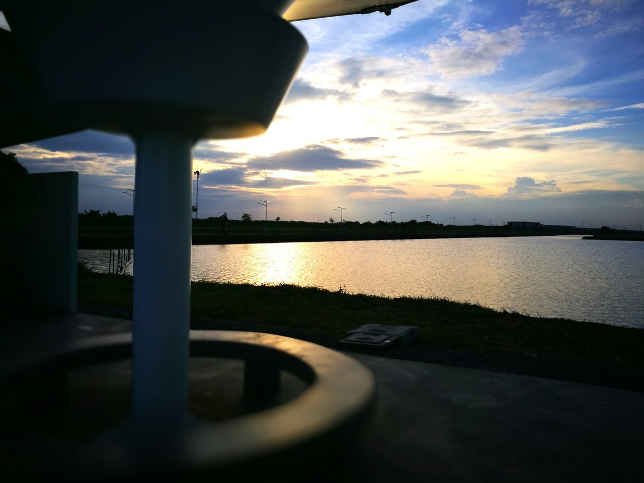 CLOSE-UP OF REFLECTION OF SKY ON WATER