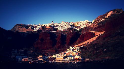 Townscape against clear blue sky