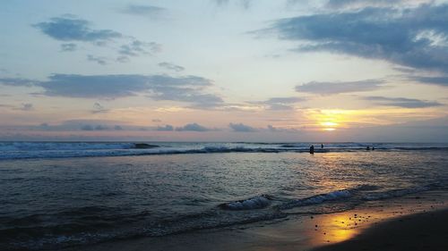 Scenic view of sea against dramatic sky