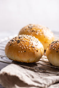 Freshly baked burger buns on a table