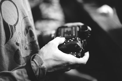 Close-up of hand holding camera