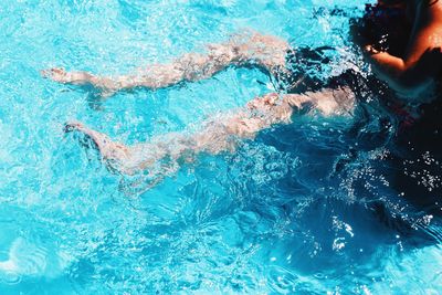 Low section of person in swimming pool