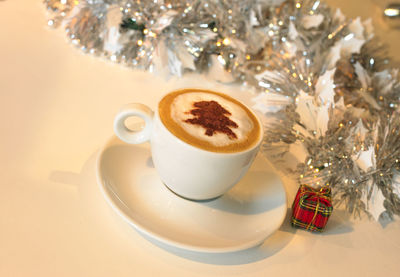 Close-up of coffee cup on table