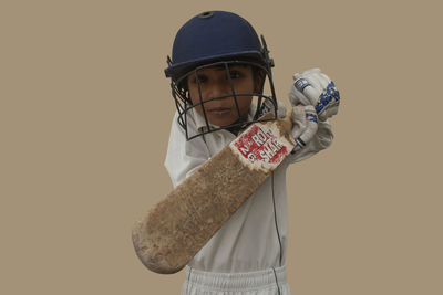 Portrait of boy holding umbrella