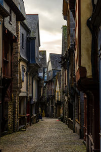 Narrow street amidst buildings in town