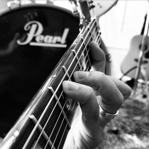 Hands playing guitar