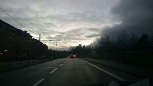 View of road against cloudy sky