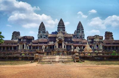 Low angle view of coliseum against sky