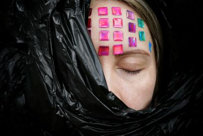 Cropped image of mid adult woman with eyes closed