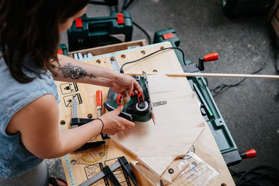 High angle view of woman working in workshop