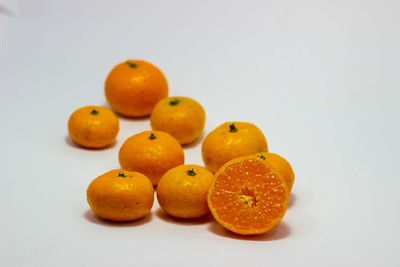 Close-up of oranges against white background