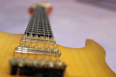 Close-up of guitar on table